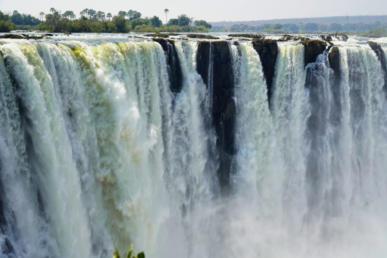 The wide curtain of Victoria Falls on the Zambezi River in Zimbabwe