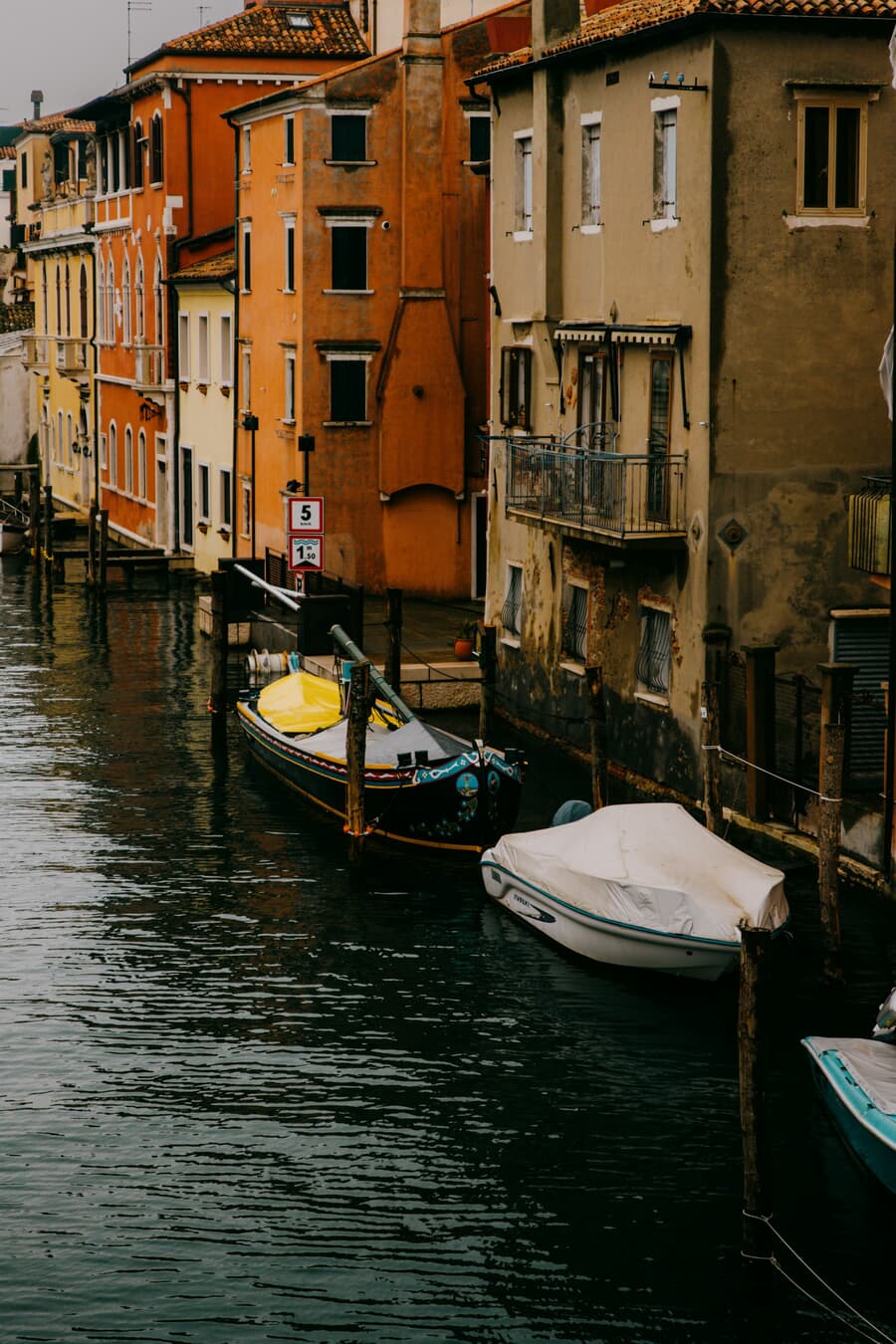 Fishing boats along the canal in Chioggia, the historic fishing town at the southern edge of the Venetian lagoon.
