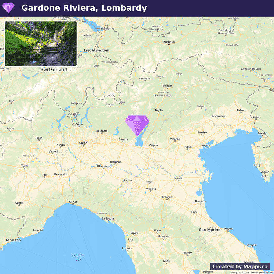 A map highlighting the location of Gardone Riviera in Lombardy, Italy, marked with a purple pin, with a small inset photo showing a scenic view of a walking path through lush greenery in the region.