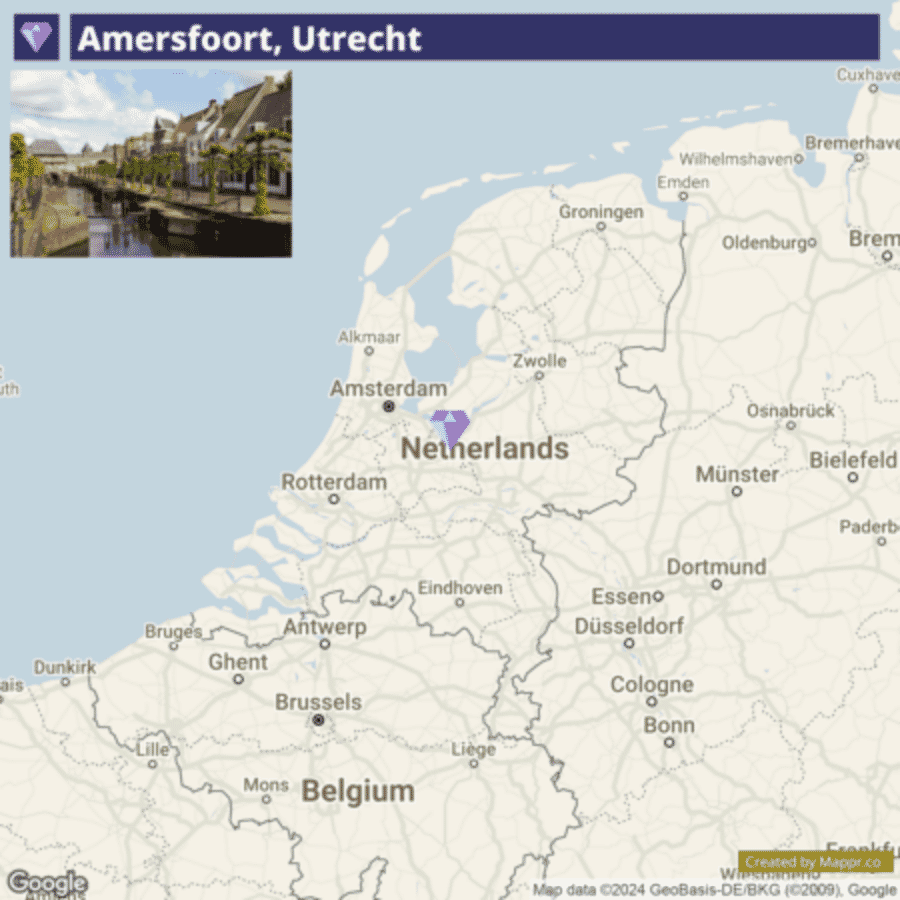 A map showing Amersfoort, Utrecht highlighted with a purple marker in the Netherlands, along with surrounding cities and country borders, including parts of Belgium and Germany. The inset in the upper left corner features a scenic view of Amersfoort with traditional buildings and a canal.