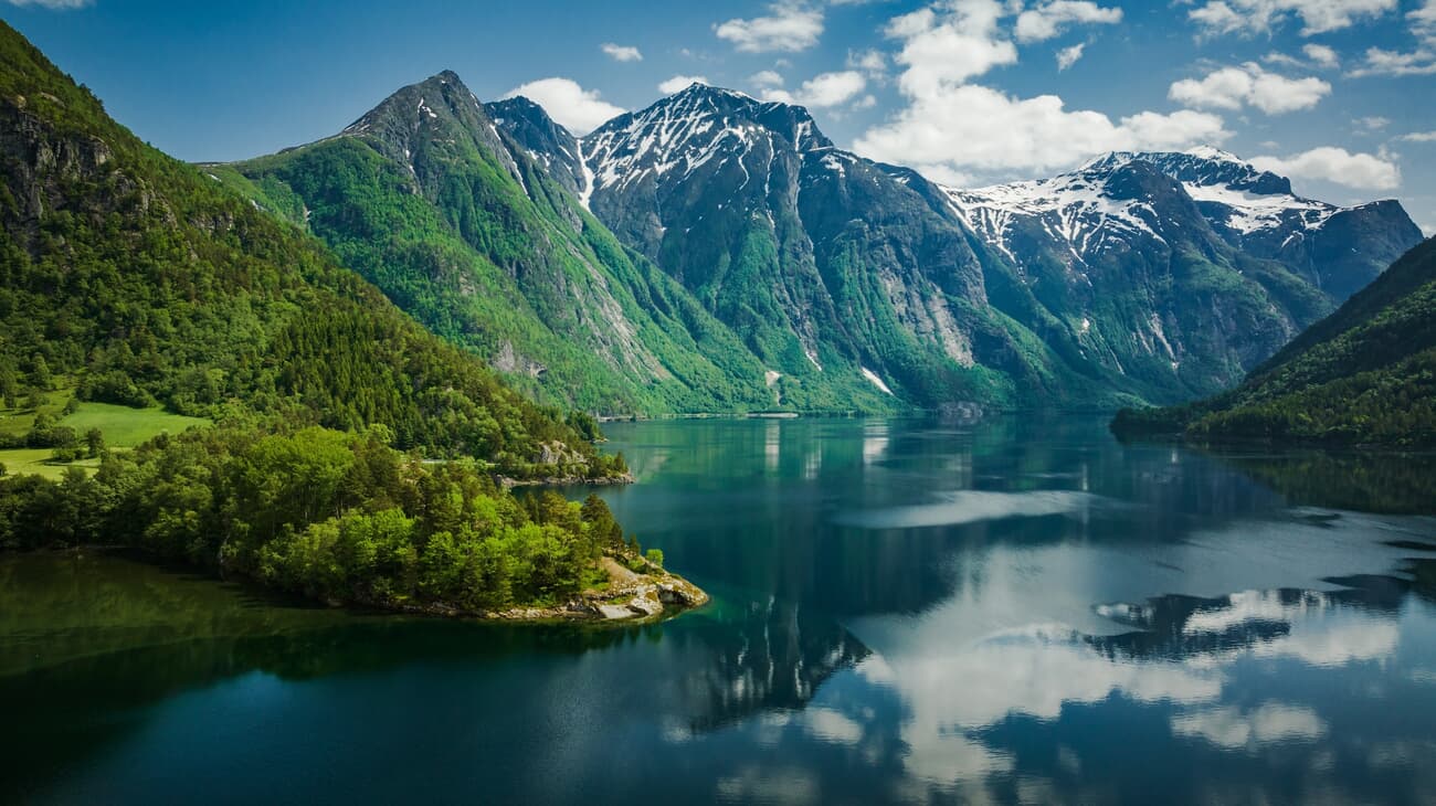 Eikesdalsvatnet's tranquility, serene waters cradled by towering mountains