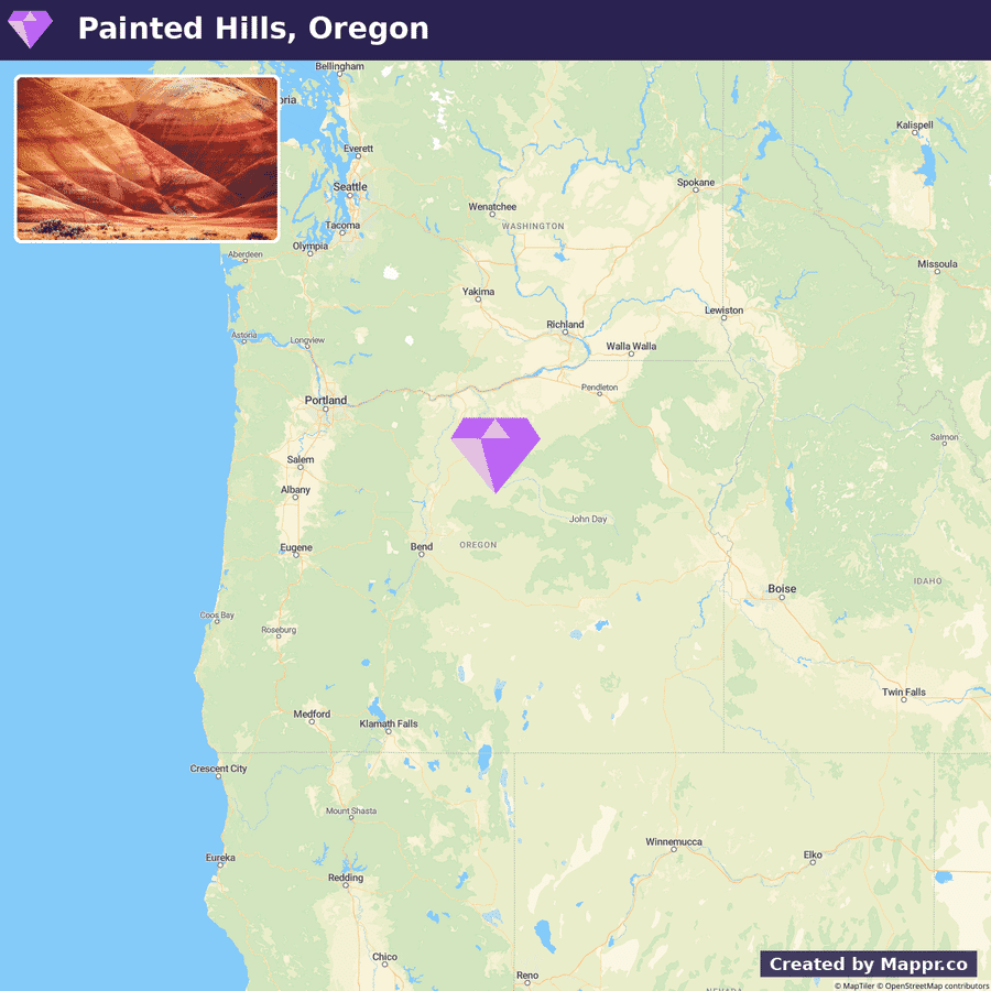 Alt text: A map showing the location of Painted Hills, Oregon, with an inset photo of stratified red and beige hills against a blue sky. The map highlights the northwestern United States with Oregon at the center and a purple diamond marking the Painted Hills' location.