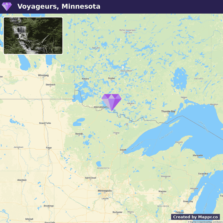 A map highlighting Voyageurs National Park in Minnesota, with parts of the US and Canada visible, including Winnipeg and the Great Lakes. A purple map pin marks the park's location, and an inset photo shows a forested area with a stream and fallen logs.