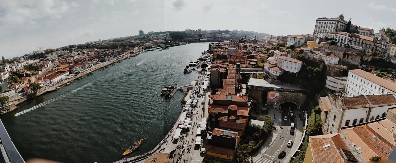 The double-deck Dom Luís I Bridge arches over the Douro River, linking Porto with the port-wine cellars of Vila Nova de Gaia.