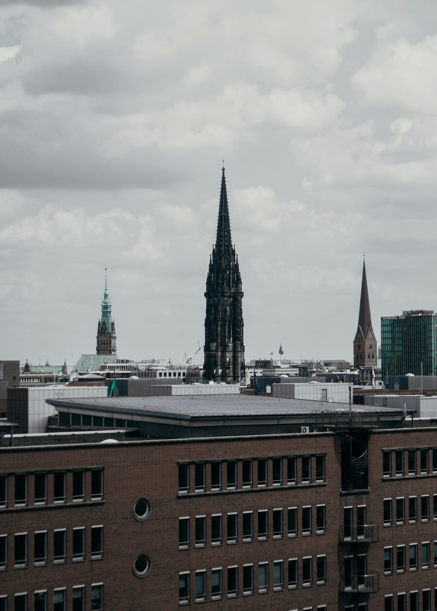 The blackened Gothic spire of St. Nikolai rising over the Hamburg skyline, the surviving part of the bombed church kept as a war memorial