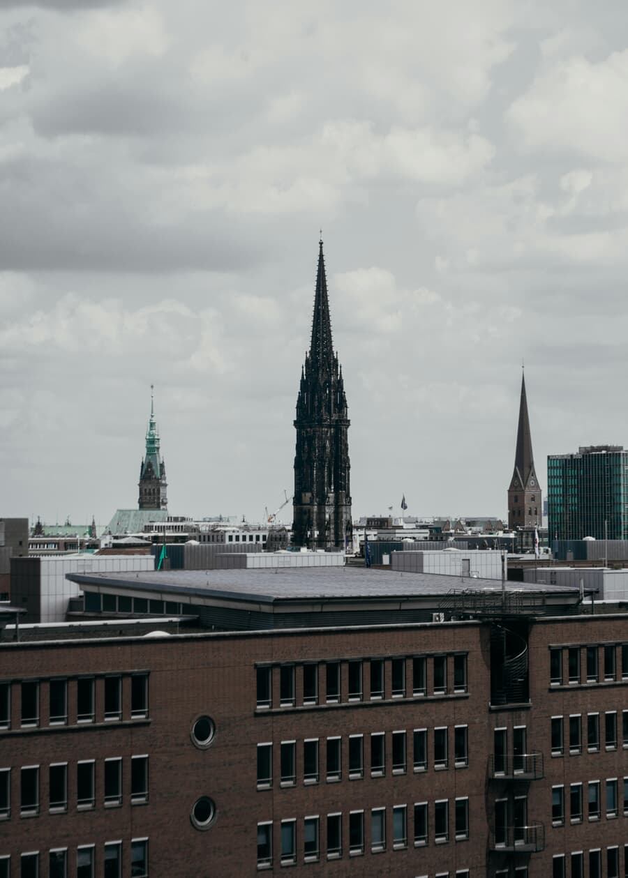 The blackened Gothic spire of St. Nikolai rising over the Hamburg skyline, the surviving part of the bombed church kept as a war memorial