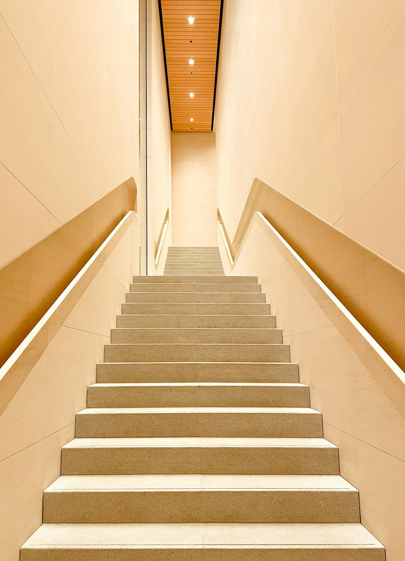 The wooden staircase inside Appleโs Sanlitun store in Beijing