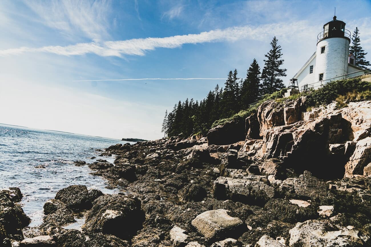 Bass Harbor Head Lighthouse stands over the granite shore of Acadia National Park, Maine