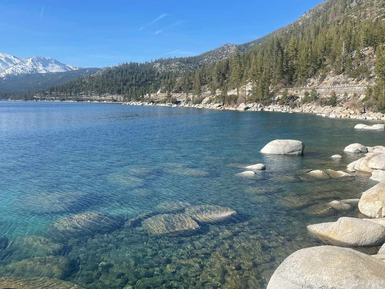 Granite boulders sit in the famously clear water along the Lake Tahoe shoreline