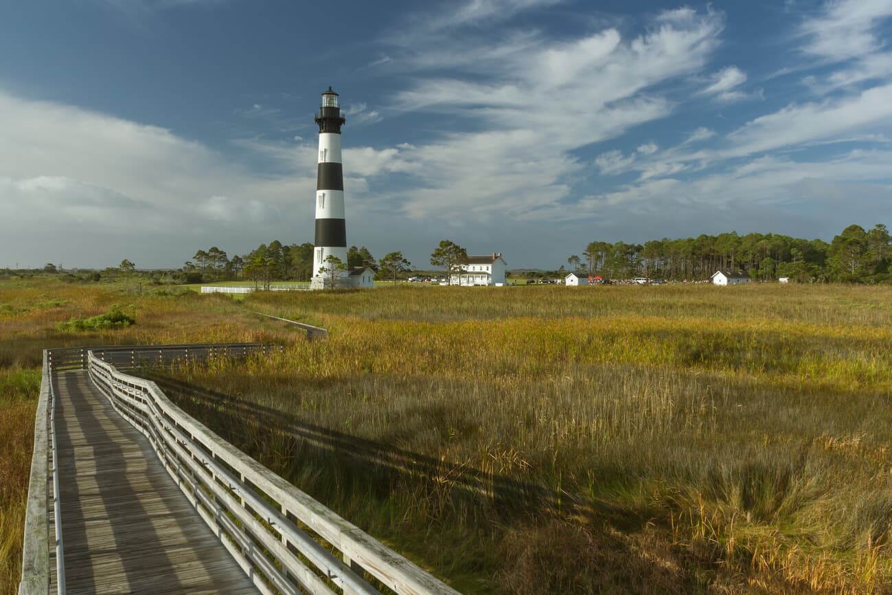Bodie Island Lighthouse rises over the marsh boardwalk on North Carolina's Outer Banks
