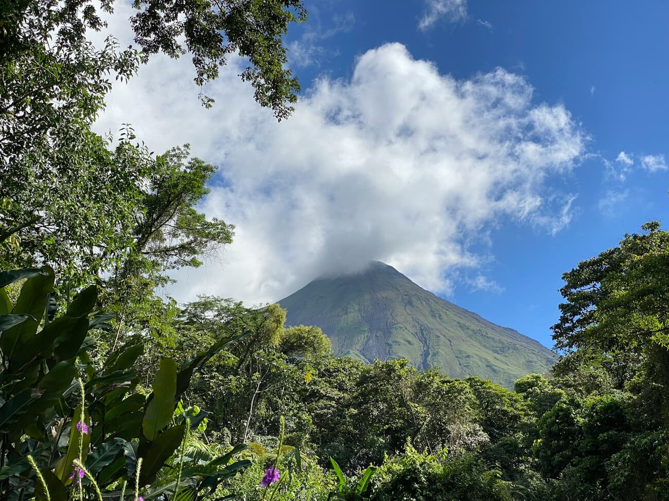 The cone of Arenal volcano rises above the rainforest in Costa Rica