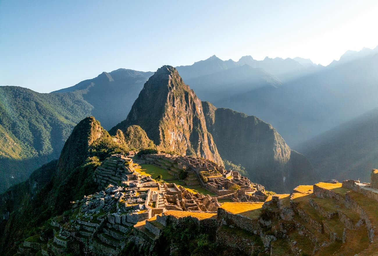 Morning light rakes across the terraces of Machu Picchu in Peru's Andes