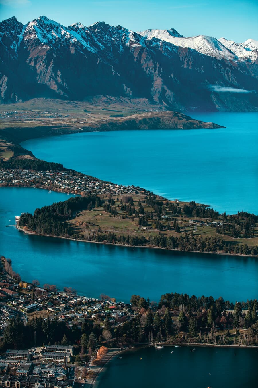 Lake Wakatipu wraps around Queenstown beneath the Remarkables range in New Zealand