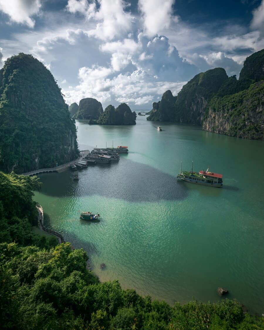 Limestone karsts rise from the emerald water of Ha Long Bay, Vietnam