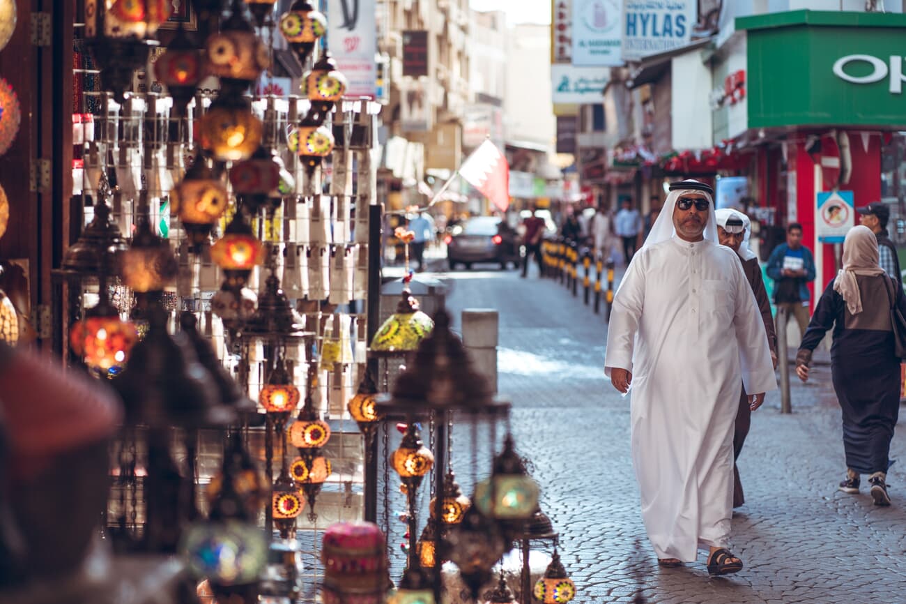A man walking in a Bahrain market street