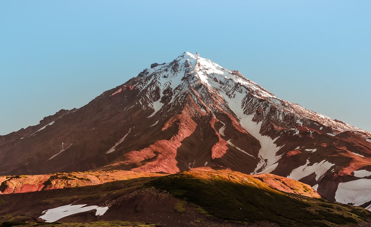 Koryaksky Volcano rising above the outskirts of Petropavlovsk-Kamchatsky on Russia's Kamchatka Peninsula