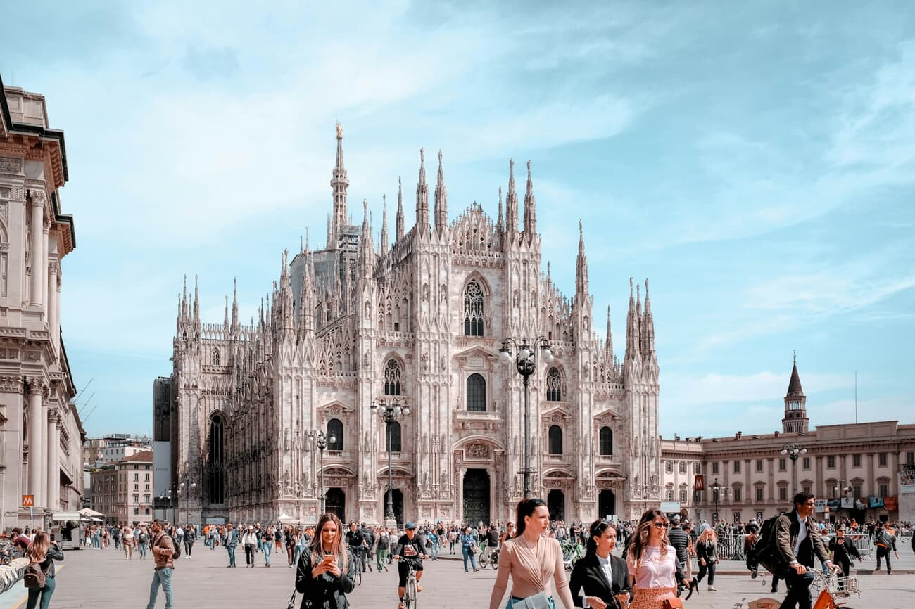 Gothic Grandeur Over Milan's Duomo: Crowds Converge on Piazza del Duomo