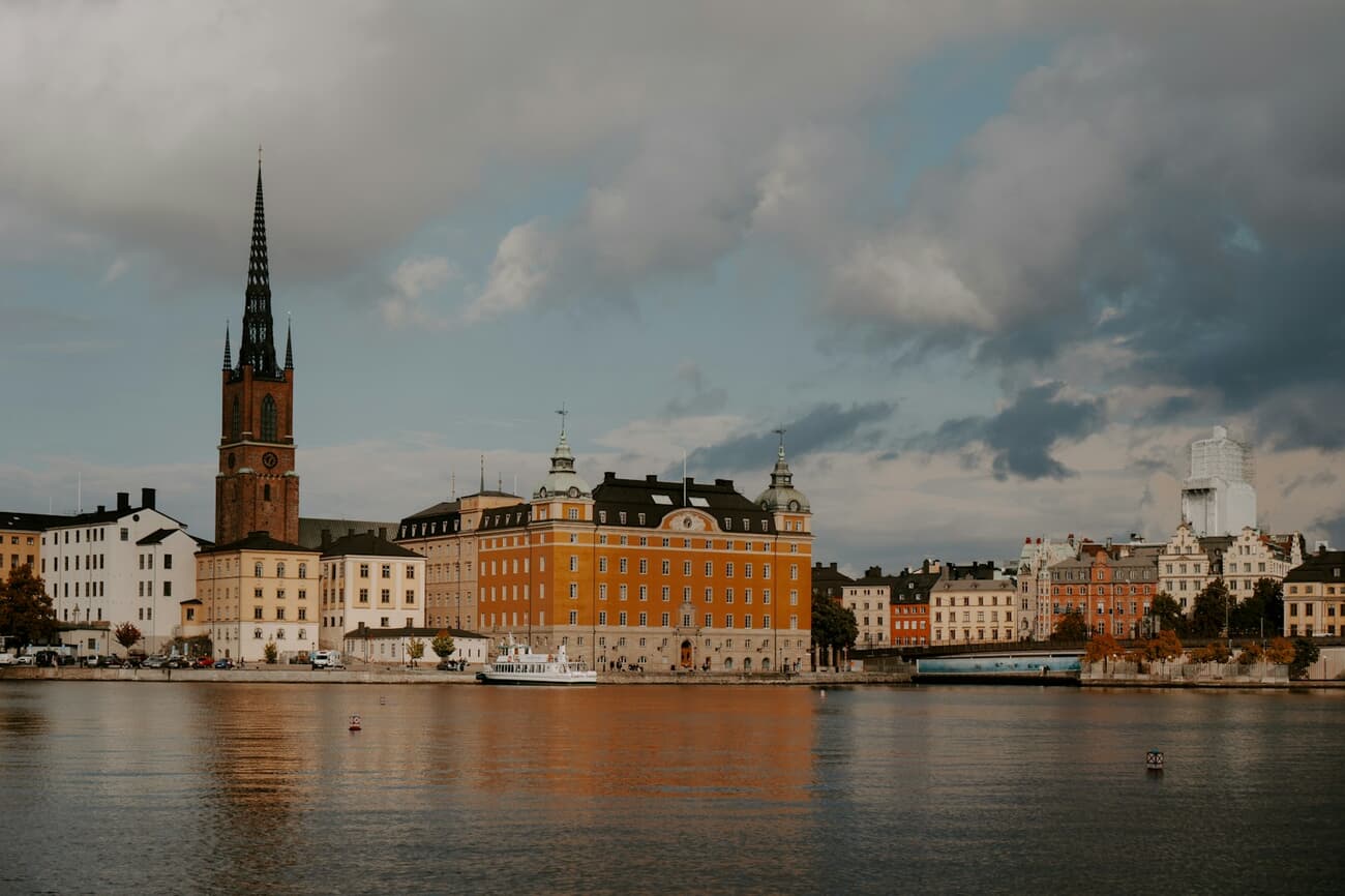 Gothic Spire Over a Calm Waterfront: A Quiet Cityscape