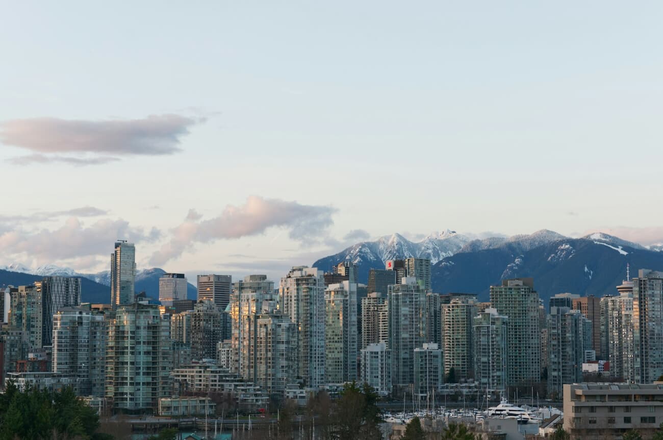 Harbor Glass: Skyline Against Snow-Capped Peaks