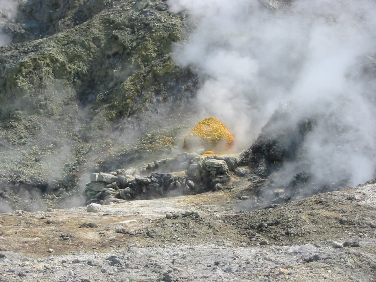 Steaming fumaroles and yellow sulphur deposits at the Solfatara crater in the Campi Flegrei caldera near Pozzuoli