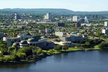 An aerial view of the Canadian Museum of History from across the Ottawa River.