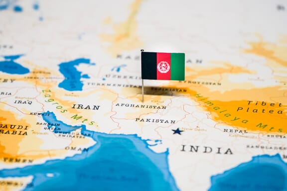 Flag pin pointing out the location of Afghanistan on the Asia map