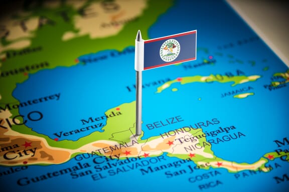 Flag pin pointing out the location of Belize on the Central America map