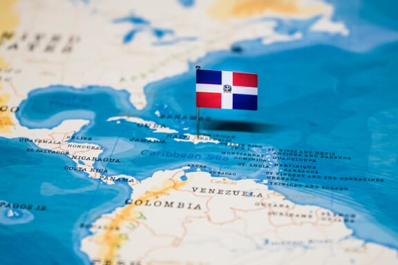 Flag pin pointing out the location of Haiti on the Central America map