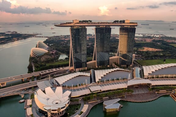 n aerial view of Marina Bay Sands at dusk in Singapore. 