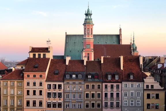 Colorful buildings can be seen at sunset in Warsaw, Poland.