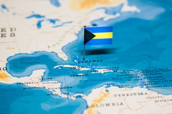 Bahamas pointed out on the map by a flag pin.