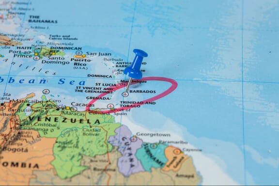 Pin pointing out Barbados on a map.