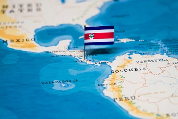 Costa Rica pointed out on the map by a flag pin.