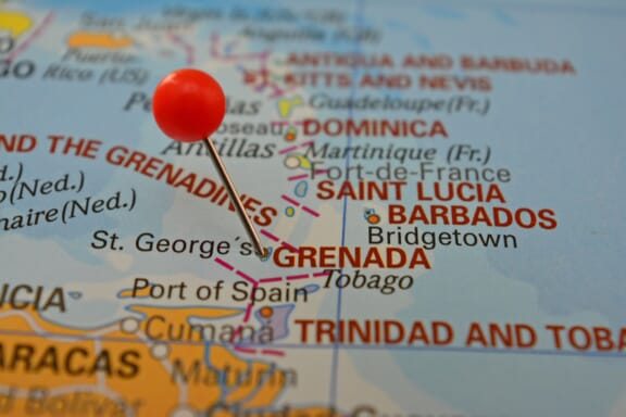 Pin pointing out Grenada on a map.
