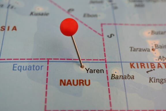 Pin pointing out Nauru on a map.