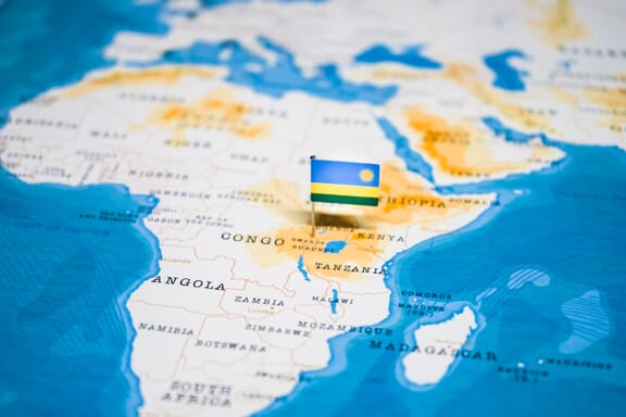 Rwanda pointed out on the map by a flag pin.