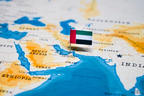 United Arab Emirates pointed out on the map by a flag pin.