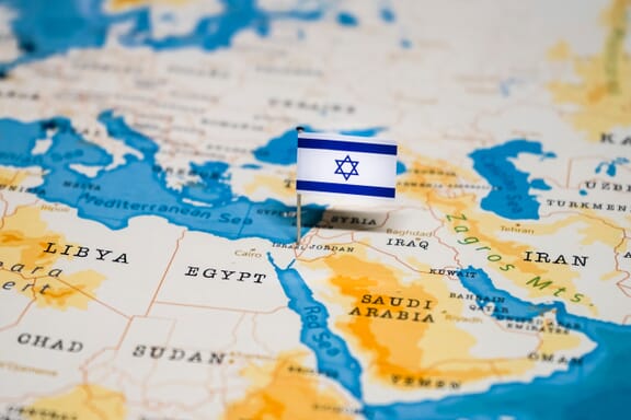Israel location on the map pointed out by a flag pin.