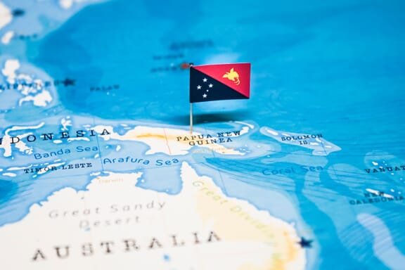 Papua New Guinea location on the map pointed out by a flag pin.