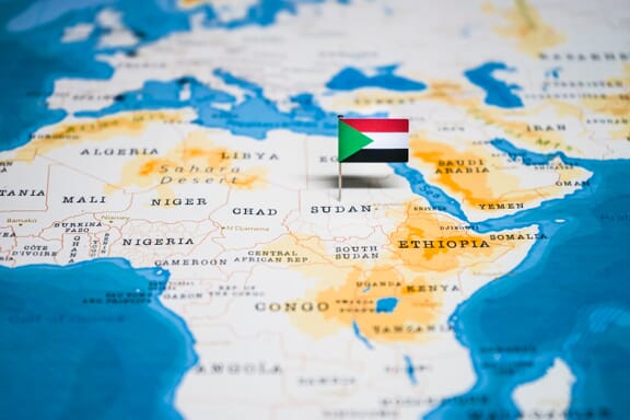 Sudan location on the map pointed out by a flag pin.