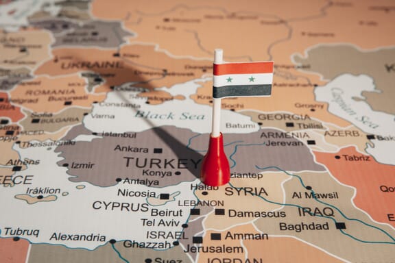 Syria location on the map pointed out by a flag pin.