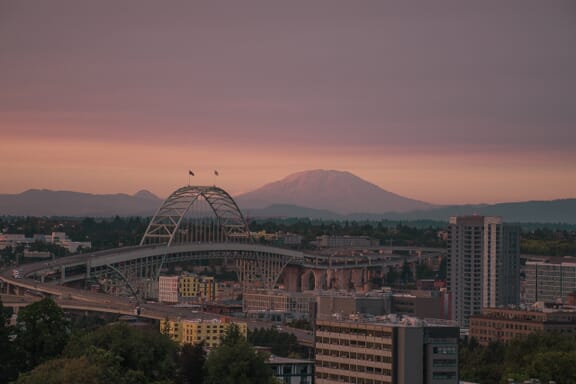 Mount Saint Helens looms in the background behind Fremont Bridge in the city of Portland, Oregon. Mount Saint Helens looms in the background behind Fremont Bridge in the city of Portland, Oregon.