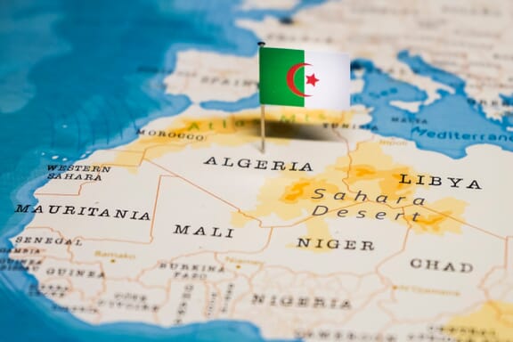 Algeria location on the map pointed out by a flag pin.