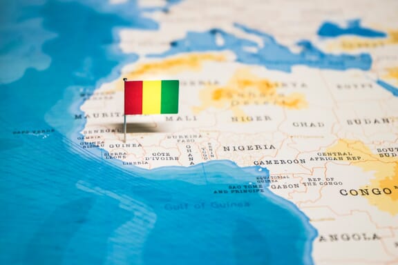 Guinea location on the map pointed out by a flag pin.