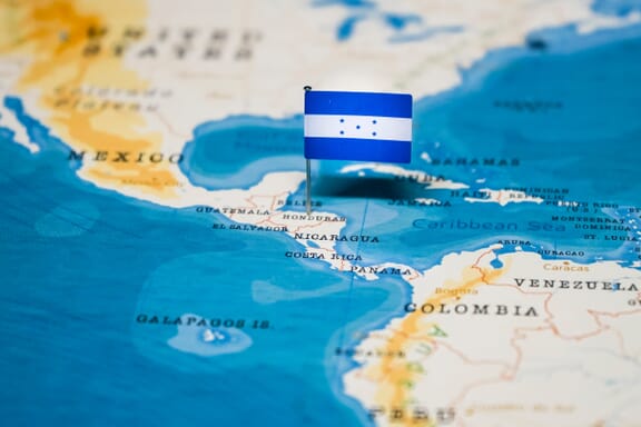 Honduras location on the map pointed out by a flag pin.