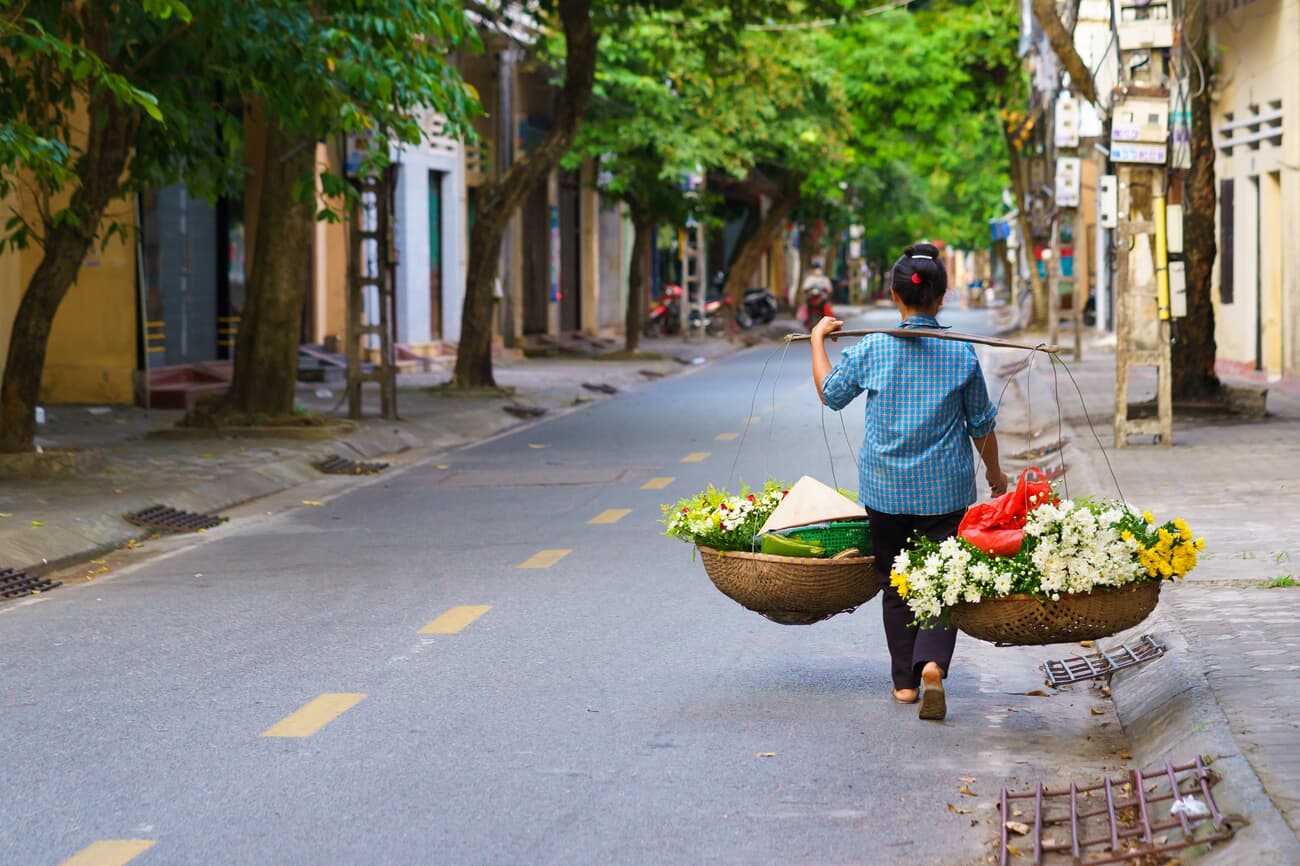 Hanoian woman with flowers to sell