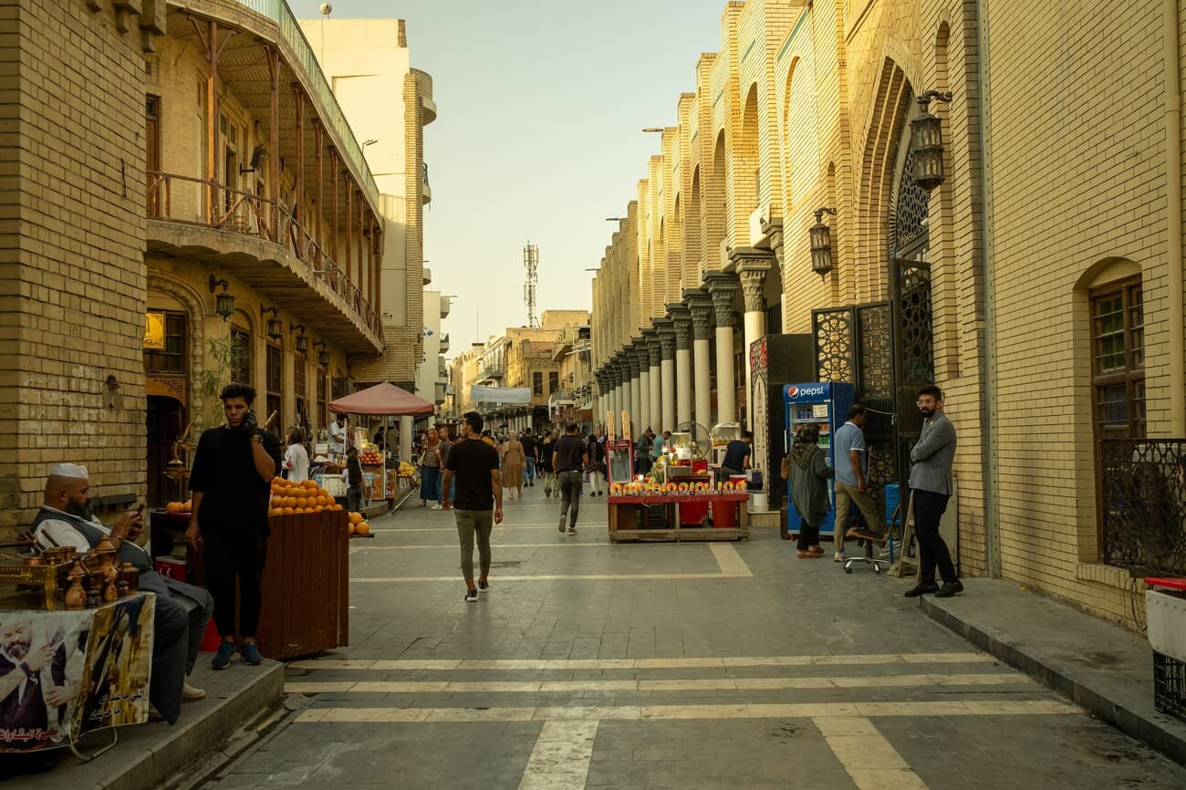 Locals commute on Mutanabbi Street