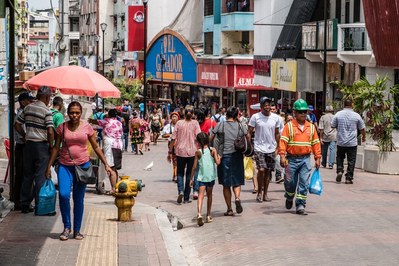Locals commuting on pedestrian-only street in Panama City, melding traditional lifestyles with modern urban planning