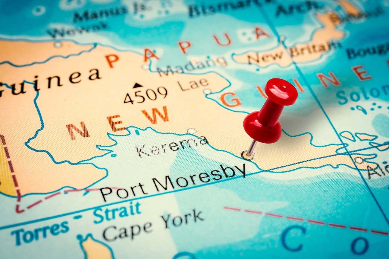 Port Moresby, the capital of New Guinea highlighted by a pin on a map.