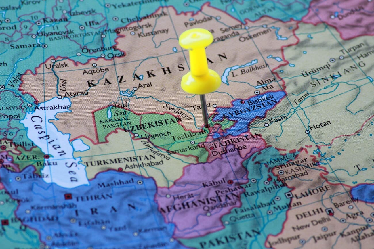 A yellow pin on uzbekistan of the world map travel